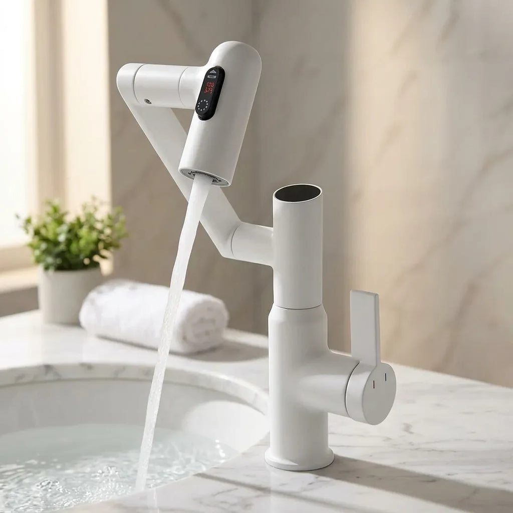 Torneira monocomando com sensor de temperatura branca instalada em bancada de mármore branco com cuba de banheiro